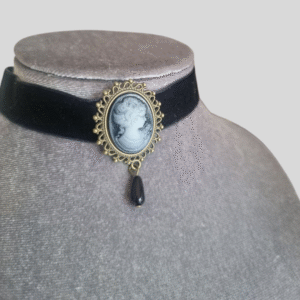 Black velvet cameo choker with grey vintage pendant and drop bead on velvet display