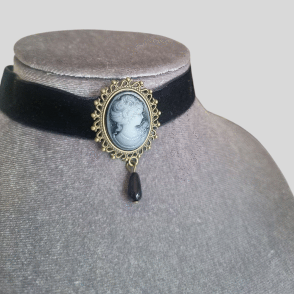 Black velvet cameo choker with grey vintage pendant and drop bead on velvet display