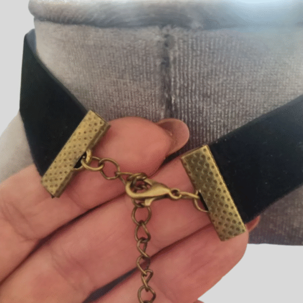 Adjustable clasp and antique brass end clips of black velvet cameo choker