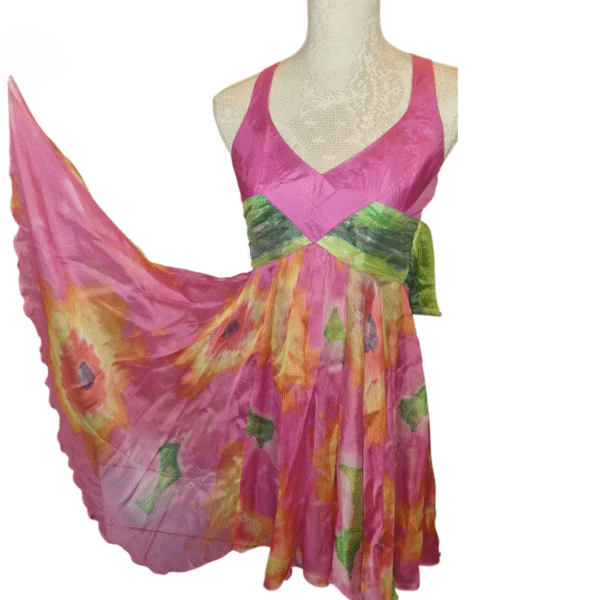 Flowing skirt of Lipsy London silk dress showing vibrant multicolour design