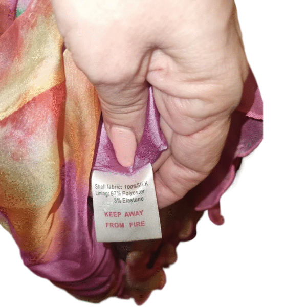 Tag showing fabric composition of Lipsy London silk dress – 100% silk shell