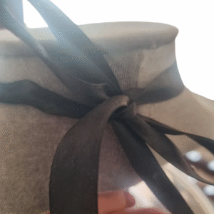Black satin ribbon tie-back on handmade mother-of-pearl and abalone pendant choker necklace