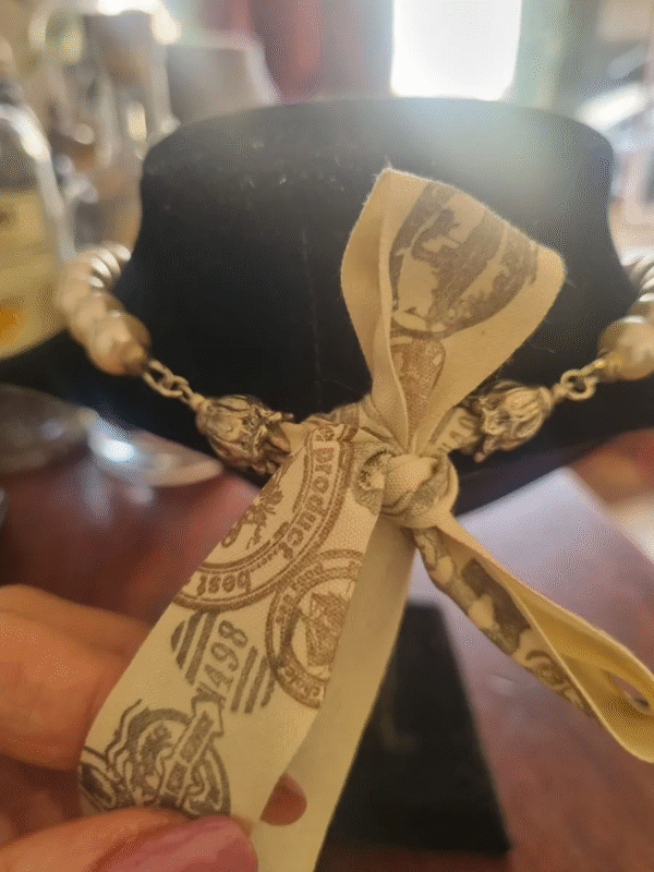 handmade nacreous shimmer pearl necklace with silver pendant and ribbon tie Back side