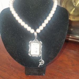 handmade nacreous shimmer pearl necklace with silver pendant and ribbon tie