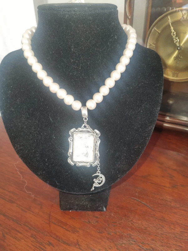 handmade nacreous shimmer pearl necklace with silver pendant and ribbon tie